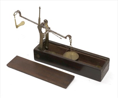 Lot 1084 - An ebony cased equal arm pull-out scale