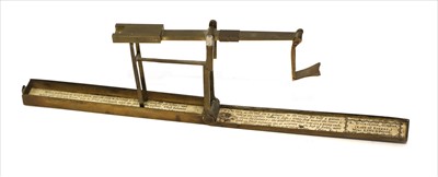 Lot 1086 - A brass cased folding coin scale