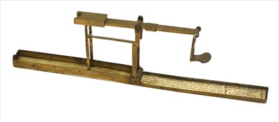 Lot 1089 - A brass cased folding coin scale