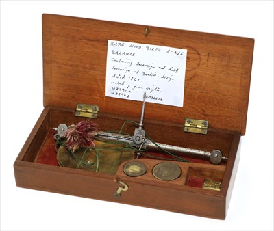 Lot 1097 - A walnut cased coin scale