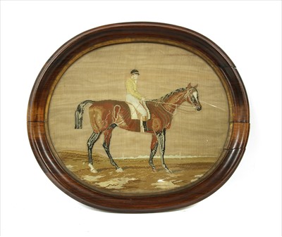 Lot 657A - A Victorian needlepoint picture of a jockey on a horse