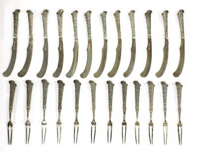 Lot 45 - A matched set of twelve Victorian English and Scottish silver fruit knives and forks
