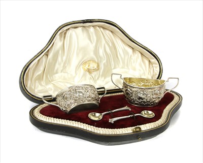 Lot 250 - A cased pair of twin handled open salt cellars and spoons