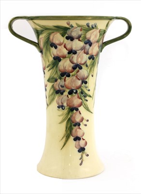 Lot 54 - A William Moorcroft Macintyre twin-handled 'Wisteria' vase