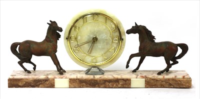 Lot 135 - An Art Deco marble and spelter clock