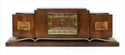 Lot 298 - An Art Deco walnut and gilt mantel clock