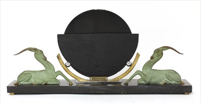 Lot 204 - An Art Deco patinated bronze mounted mirror