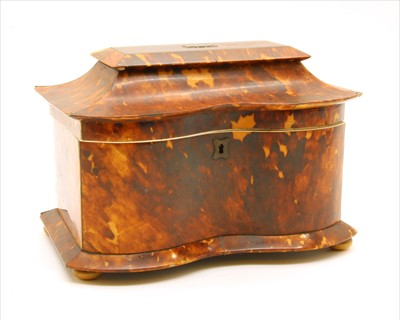 Lot 624 - An early 19th century tortoiseshell tea caddy of serpentine outline