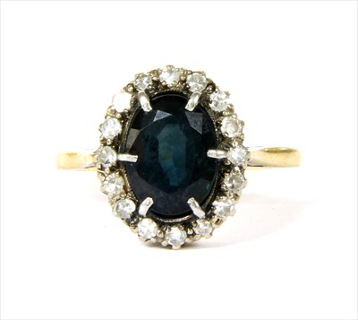 Lot 86 - A gold sapphire and diamond cluster ring
