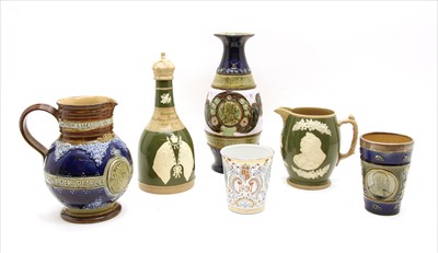 Lot 502 - A collection of Doulton stoneware commemorative items