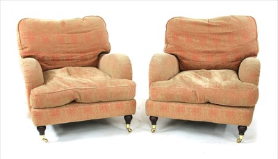 Lot 799 - A pair of Howard style armchairs