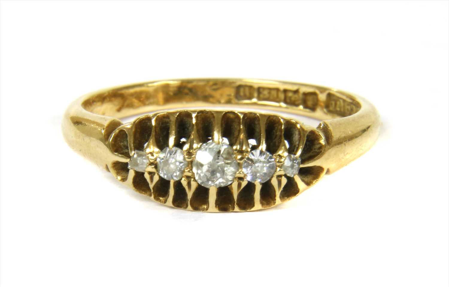 Lot 4 - An 18ct gold boat shaped five stone diamond ring
