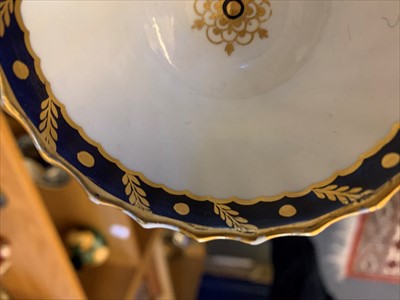 Lot 305 - An 18th century Flight blue and gilt decorated tea bowl and saucer