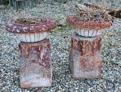 Lot 120 - A pair of terracotta urns