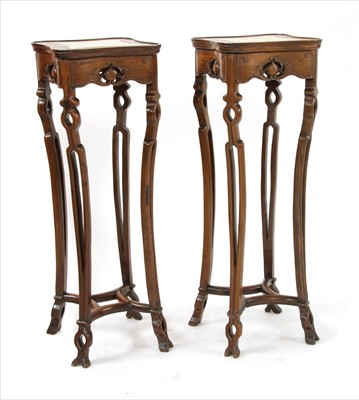 Lot 734 - A pair of early 20th century Chinese rosewood urn stands