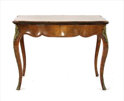 Lot 735 - A Victorian walnut fold over card table