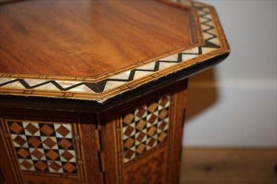 Lot 67 - An octagonal inlaid and mother-of-pearl lamp table