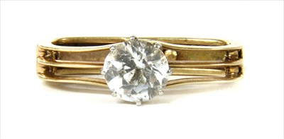Lot 218 - A gold white sapphire scarf ring