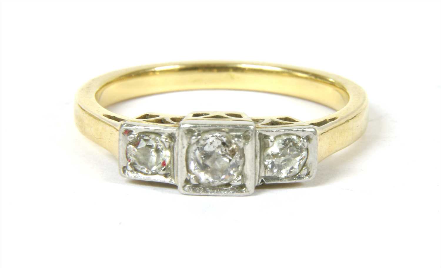 Lot 10 - A gold three stone diamond ring