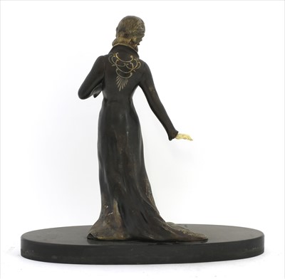 Lot 151 - An Art Deco patinated spelter figure of a lady