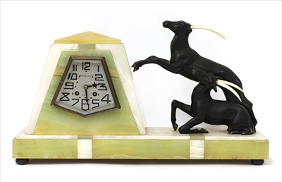 Lot 179 - An Art Deco marble and onyx mantel clock