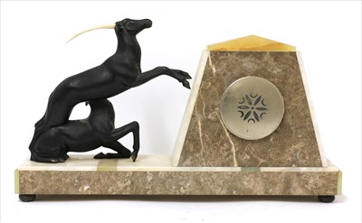 Lot 179 - An Art Deco marble and onyx mantel clock