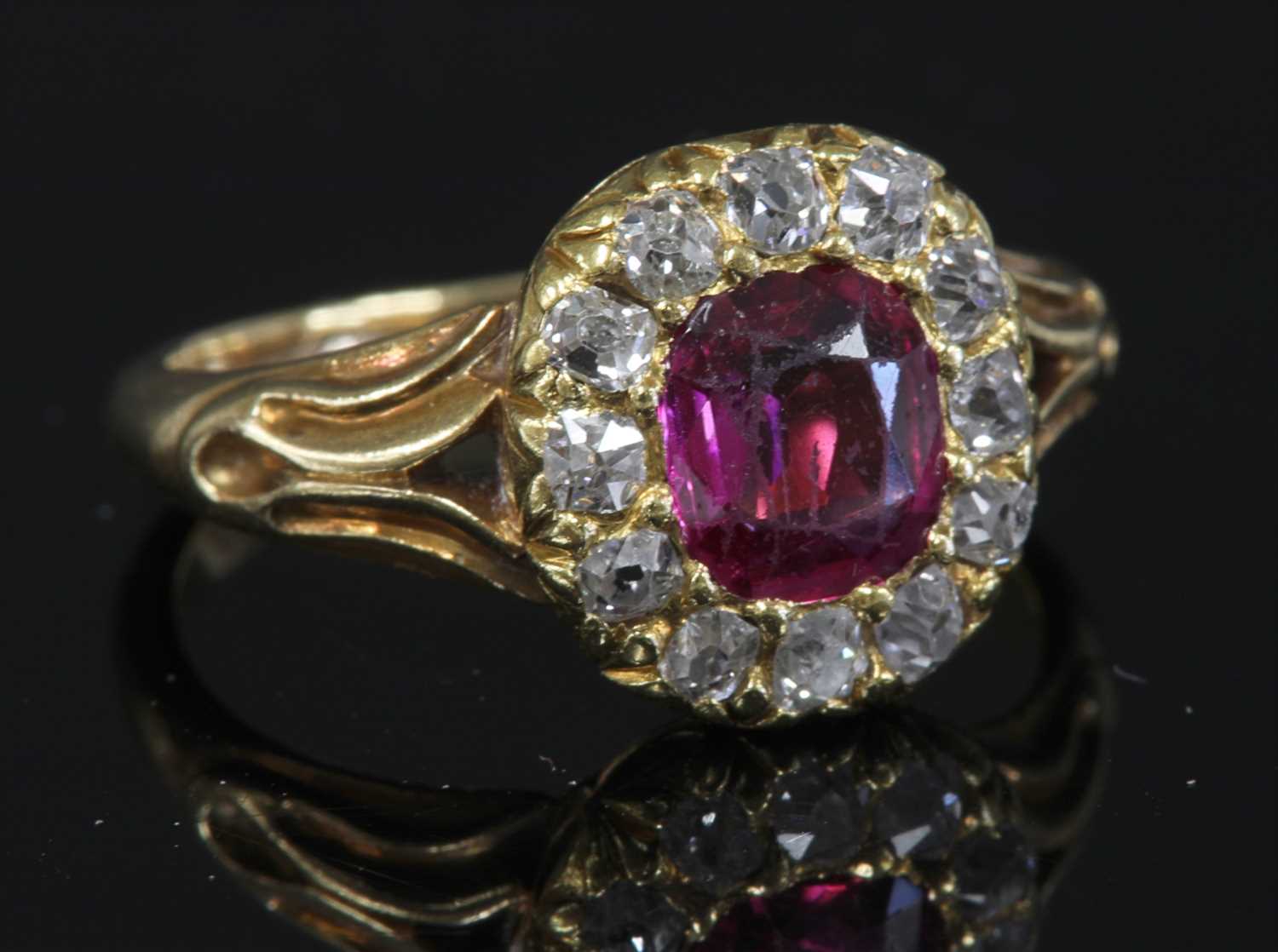 Lot 60 - A late Victorian ruby and diamond cushion-shaped cluster ring