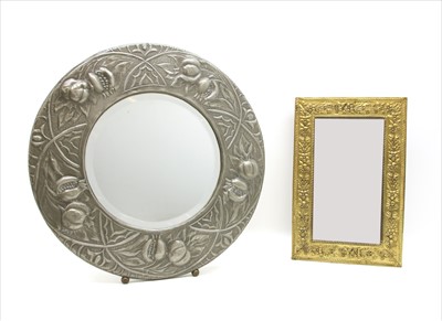 Lot 233 - An Arts and Crafts pewter wall mirror