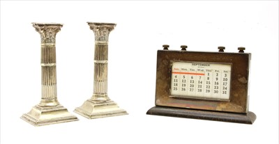 Lot 153 - A silver table top perpetual calendar