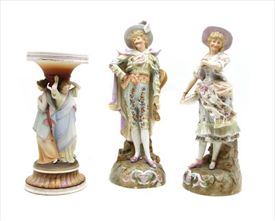 Lot 288 - A pair of late 19th century Continental porcelain figures of a man and woman in traditional costume