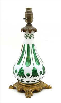 Lot 309 - A Bohemian overlaid green white glass lamp