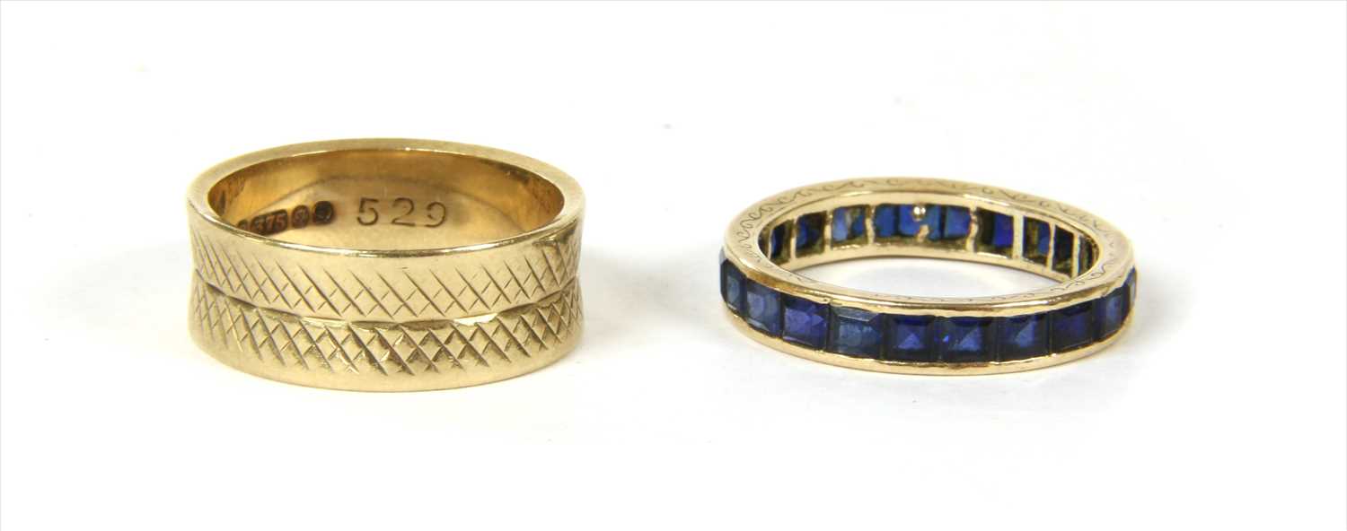 Lot 24 - A gold sapphire full eternity ring