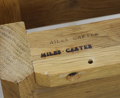 Lot 457 - A Miles Carter oak dining suite