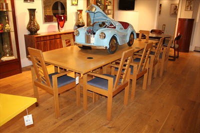 Lot 457 - A Miles Carter oak dining suite