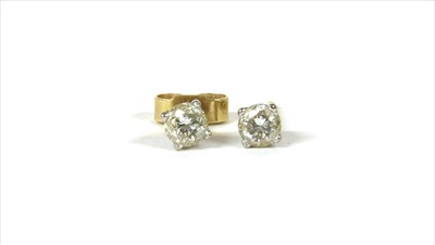 Lot 69 - A pair of 18ct gold single stone diamond stud earrings