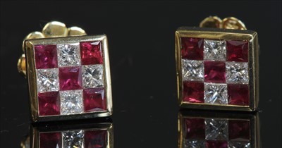 Lot 194 - A pair of gold ruby and diamond chequerboard square cluster earrings
