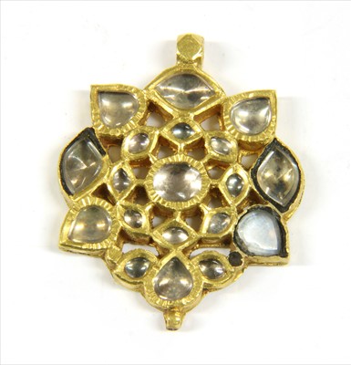 Lot 76 - An Indian gold paste set pendant
