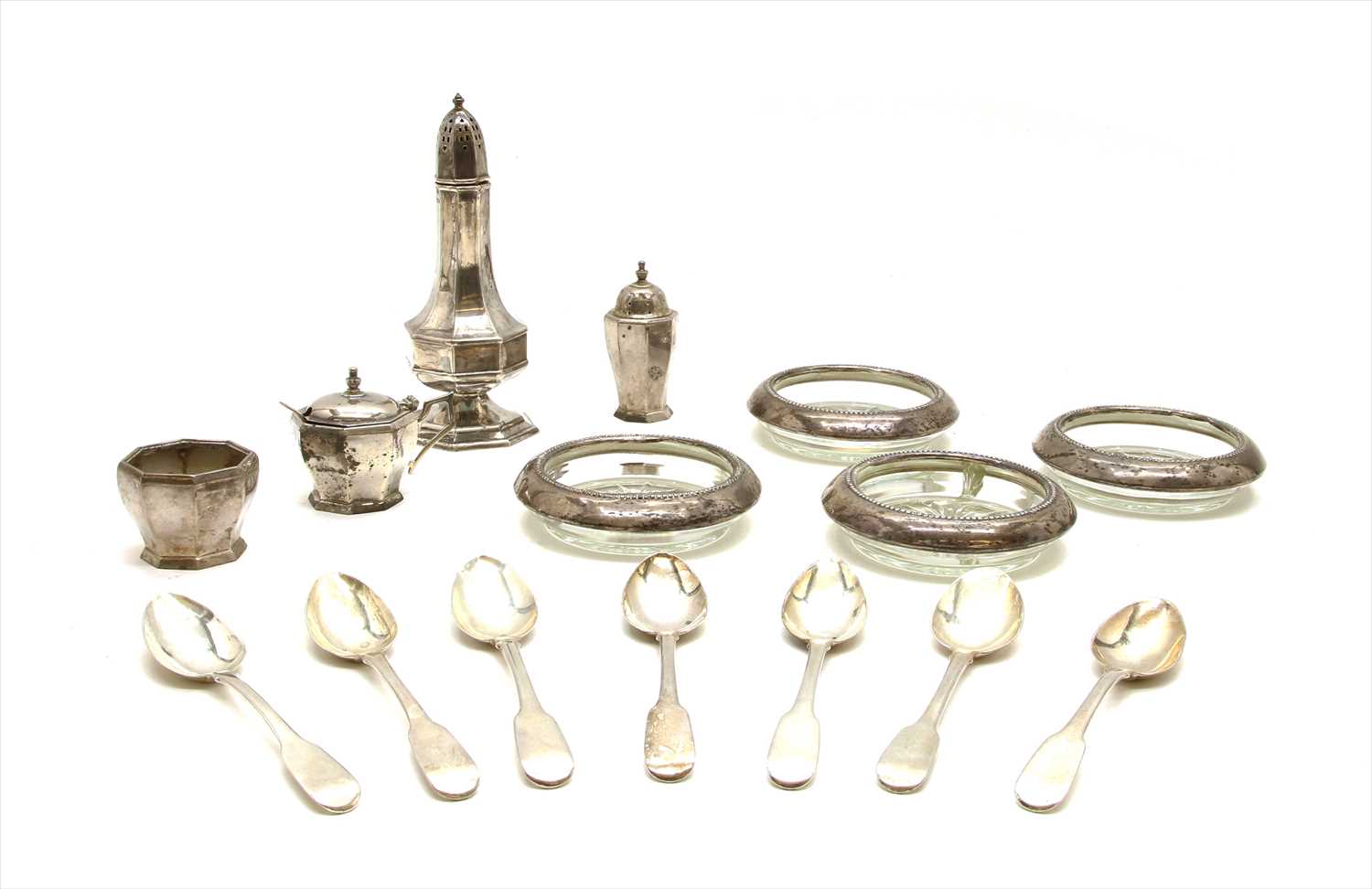 Lot 120 - A collection of silver items to include a sugar sifter