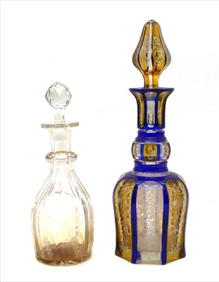 Lot 282 - A 19th century blue and amber flush decanter