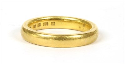 Lot 56 - A 22ct gold court section wedding ring