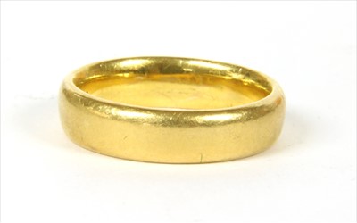 Lot 57 - A 22ct gold court section wedding ring
