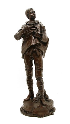 Lot 217 - A bronze model of a musketeer