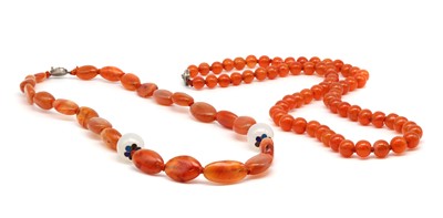 Lot 135 - A Chinese single row slightly graduated cornelian bead necklace