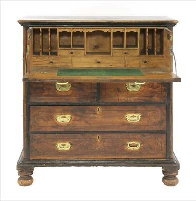 Lot 718 - A teak and camphorwood two-section campaign secretaire chest