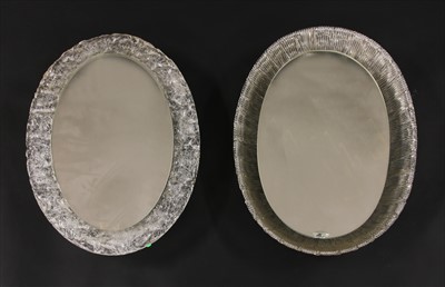 Lot 409 - Two oval moulded plastic wall mirrors