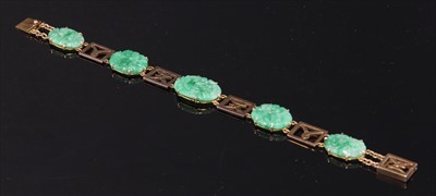 Lot 111 - A gold jadeite bracelet
