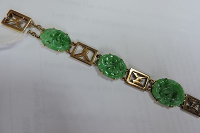 Lot 111 - A gold jadeite bracelet