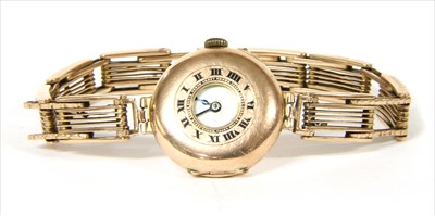 Lot 87 - A 9ct gold pin set half hunter style mechanical wristwatch