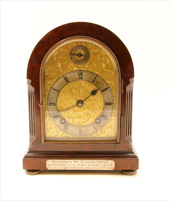 Lot 211 - Walnut mantle clock with silver presentation plaque and feet