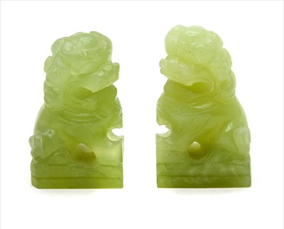 Lot 179 - Pair of jade Chinese seated dogs/lions